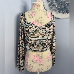 Almost Famous Swirl Pattern Long Sleeve Crop Top with Daisies